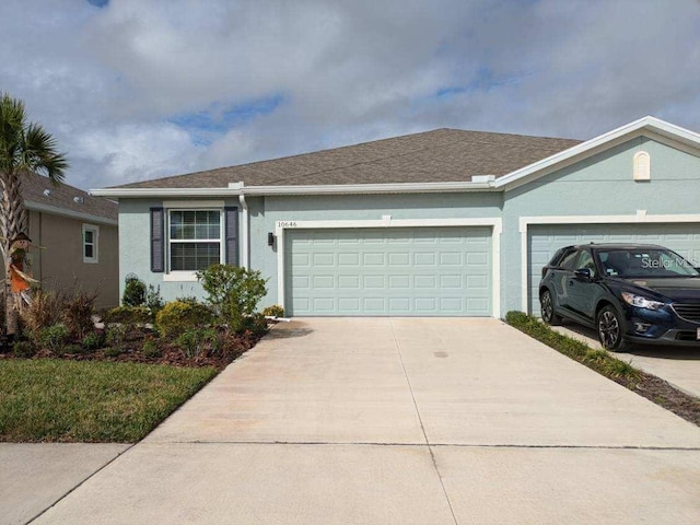 ranch-style house featuring a garage