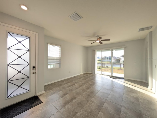 entrance foyer featuring ceiling fan