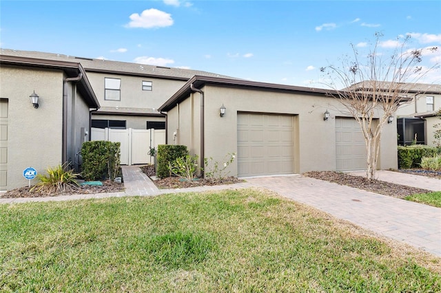 view of front of house with a garage and a front yard