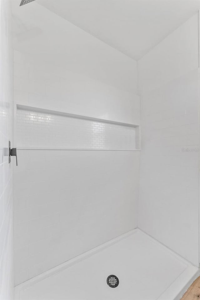 bathroom with tiled shower