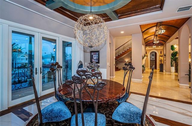 dining space featuring an inviting chandelier, coffered ceiling, and beam ceiling