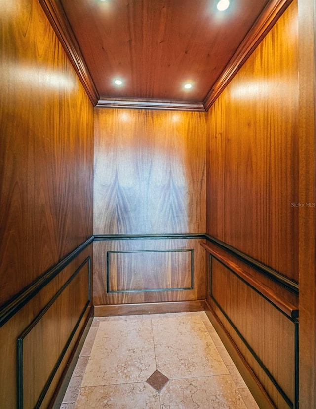 interior details featuring crown molding, elevator, and wood ceiling