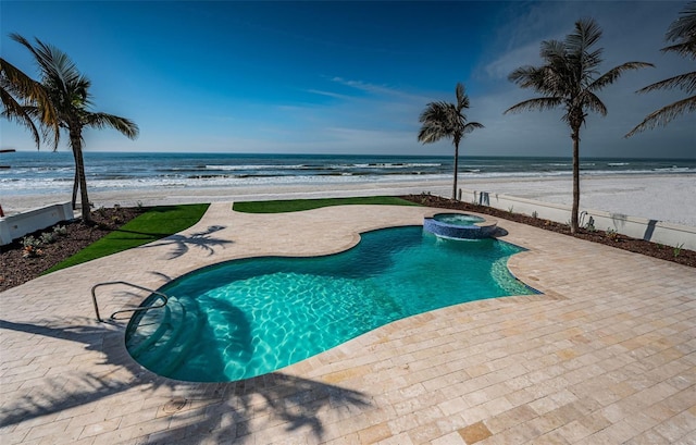 view of swimming pool with a water view, a beach view, an in ground hot tub, and a patio