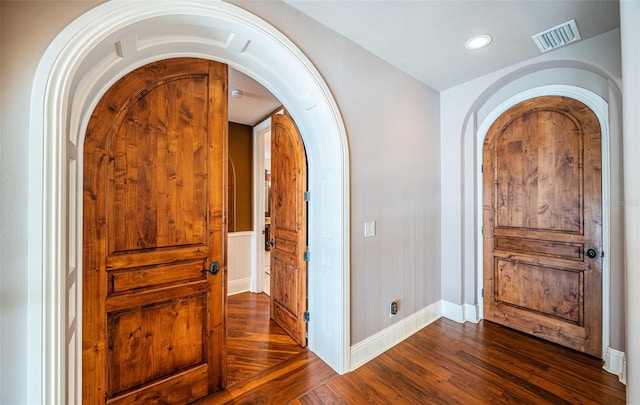 foyer entrance with dark hardwood / wood-style floors