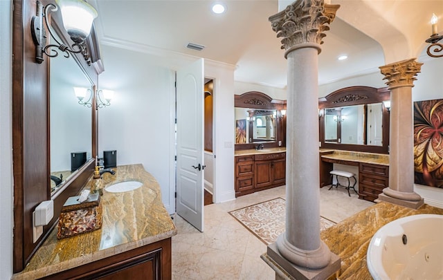 bathroom with vanity, a bath, and ornate columns