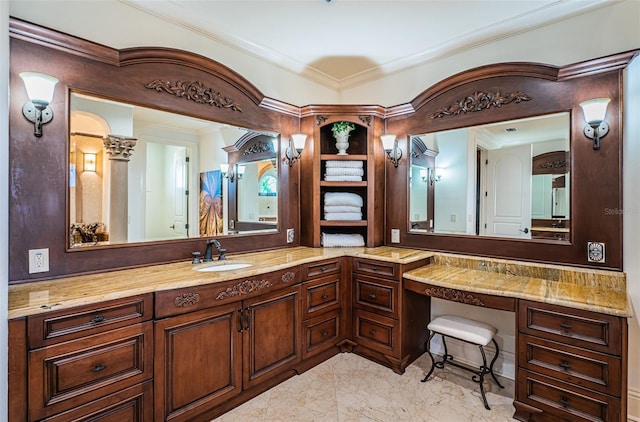 bathroom with vanity and ornamental molding