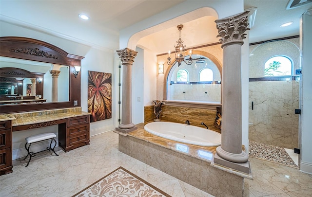 bathroom with a healthy amount of sunlight, independent shower and bath, decorative columns, and vanity