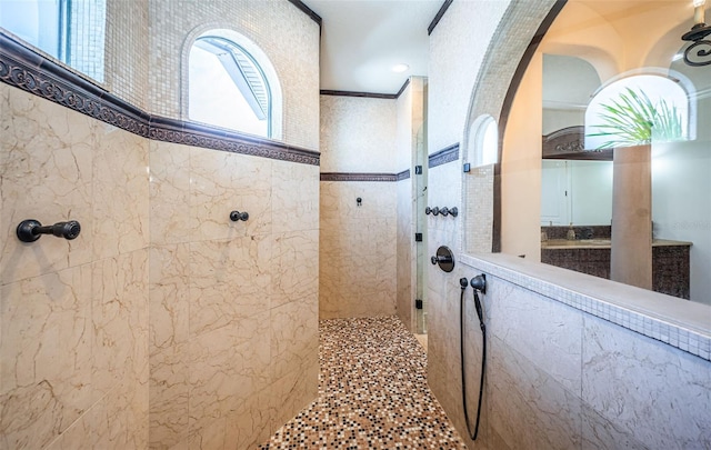 bathroom with a tile shower