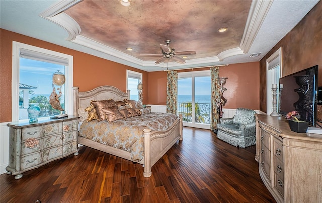 bedroom with crown molding, ceiling fan, dark hardwood / wood-style floors, access to outside, and a raised ceiling