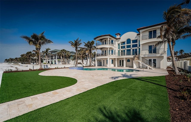 view of swimming pool with a patio area and a lawn