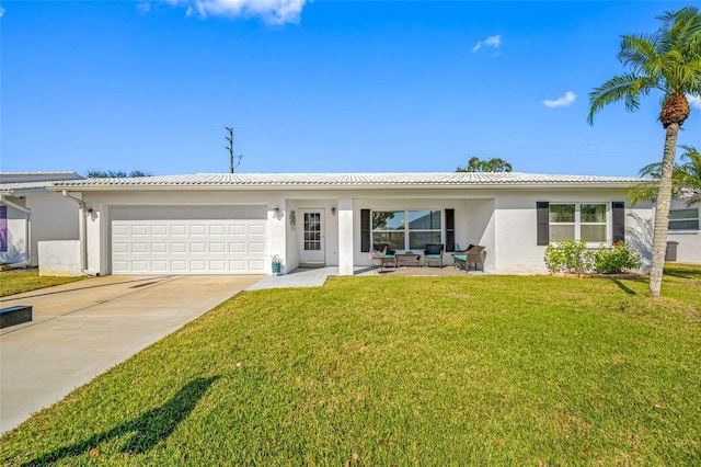 single story home featuring a garage, a front lawn, and outdoor lounge area