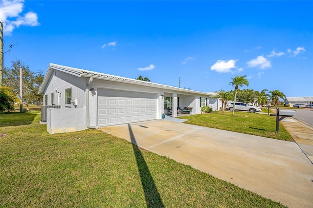 single story home featuring a garage and a front yard