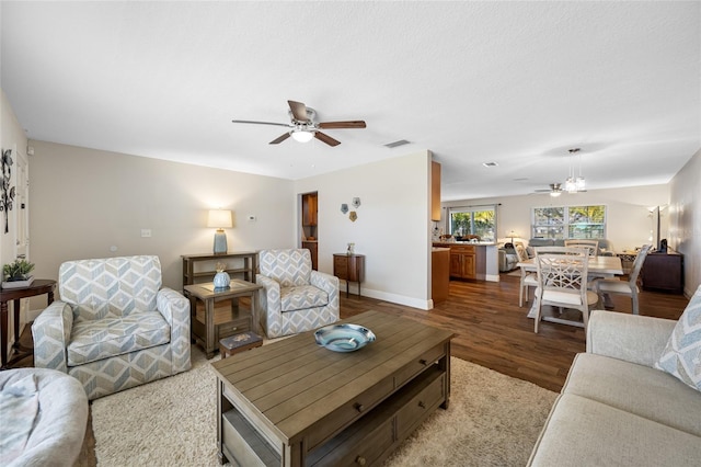 living room with hardwood / wood-style flooring and ceiling fan