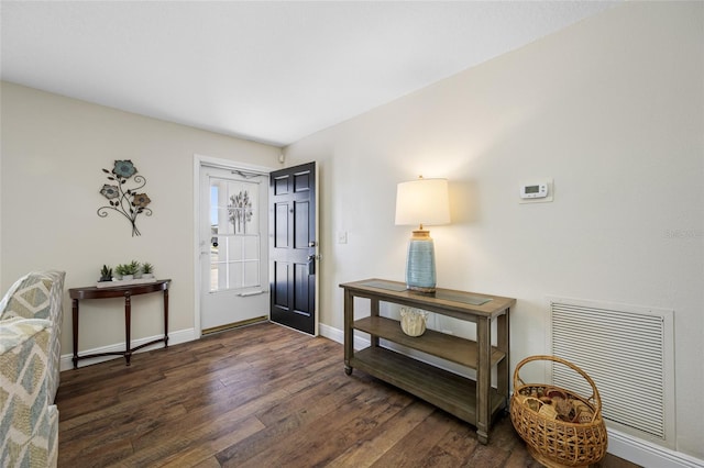 entrance foyer featuring dark hardwood / wood-style flooring