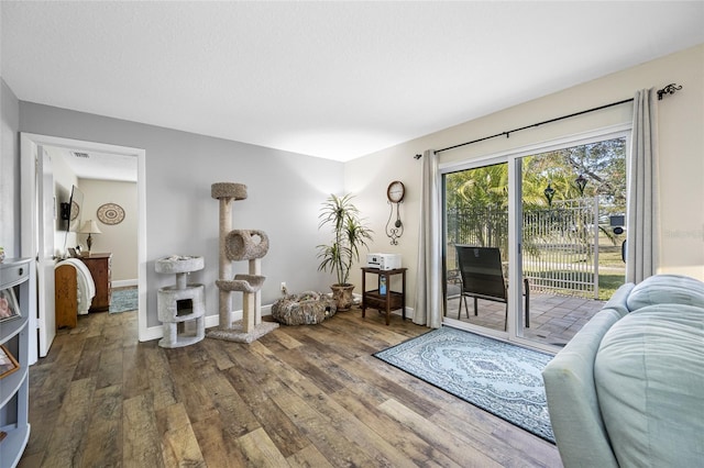 doorway with hardwood / wood-style flooring