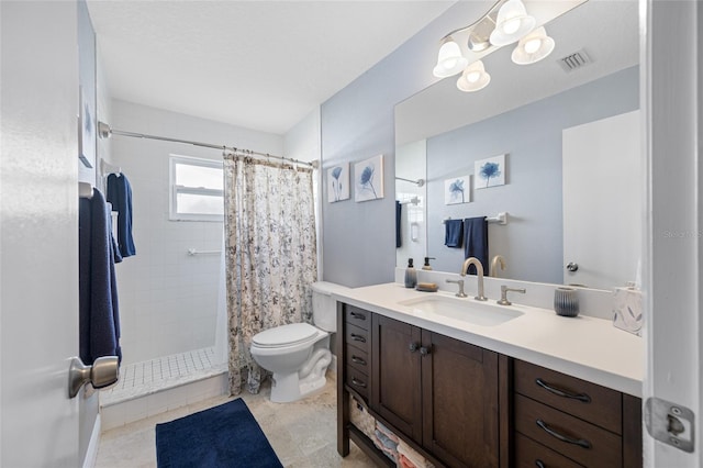 bathroom featuring vanity, curtained shower, and toilet