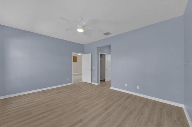 interior space with a closet, ceiling fan, and light wood-type flooring