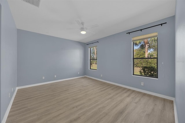 unfurnished room featuring ceiling fan and light hardwood / wood-style flooring