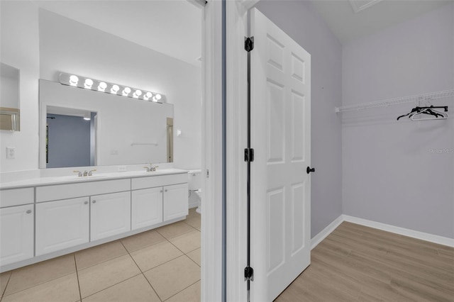 bathroom with tile patterned flooring and vanity