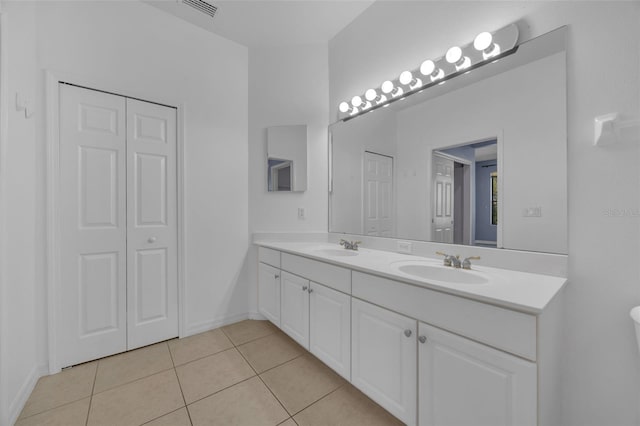 bathroom with vanity and tile patterned flooring