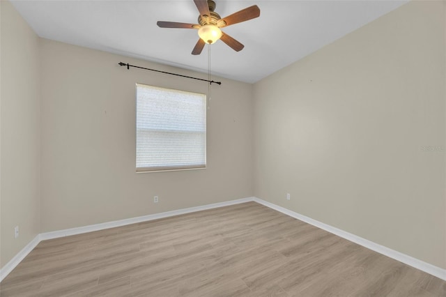 spare room featuring ceiling fan and light wood-type flooring