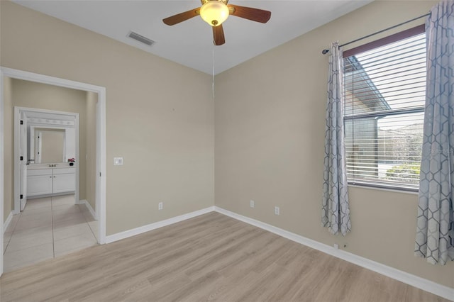 unfurnished room featuring ceiling fan and light wood-type flooring