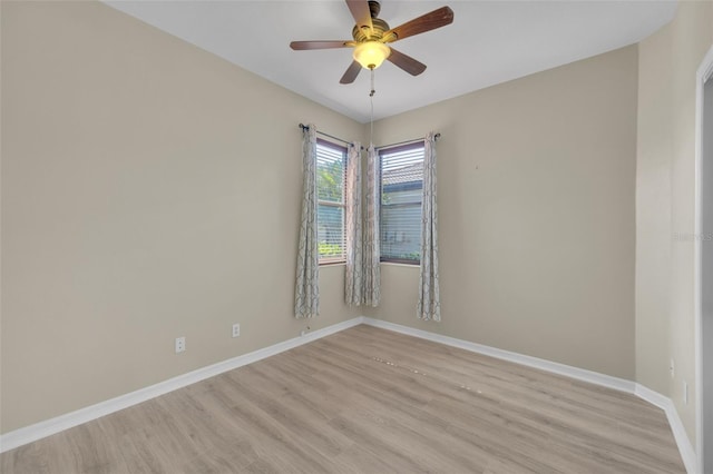 unfurnished room with ceiling fan and light wood-type flooring