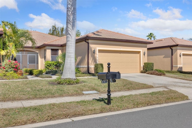 mediterranean / spanish-style house with a garage and a front lawn