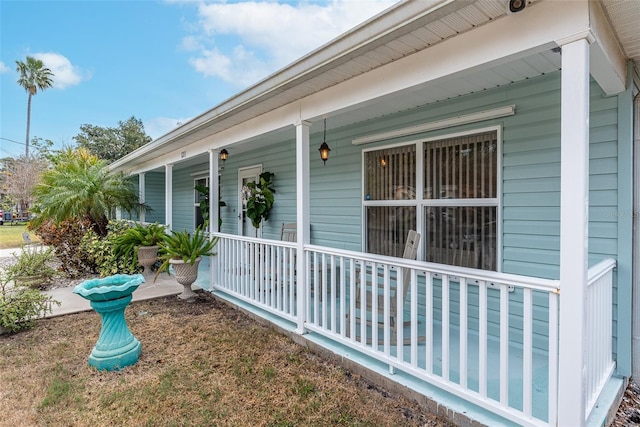 view of side of property with covered porch