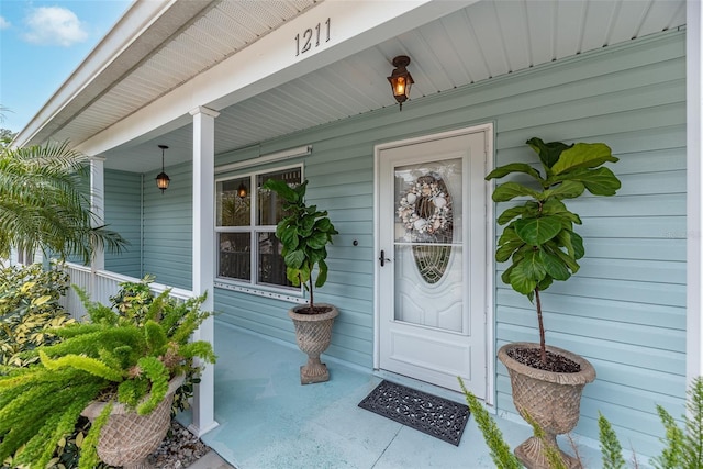 doorway to property featuring a porch