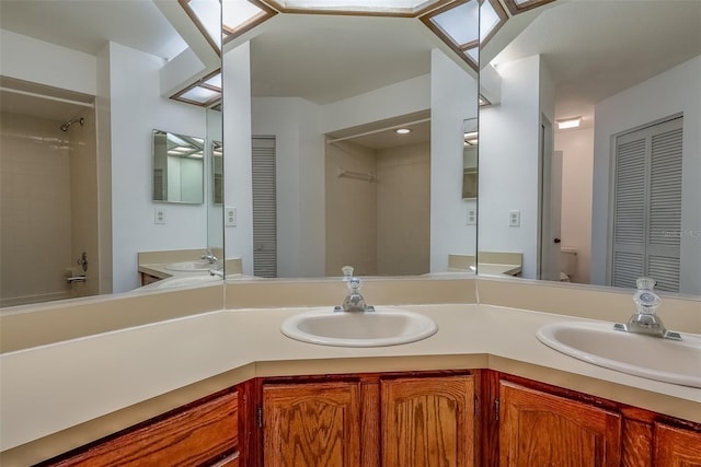 bathroom featuring a closet and a sink