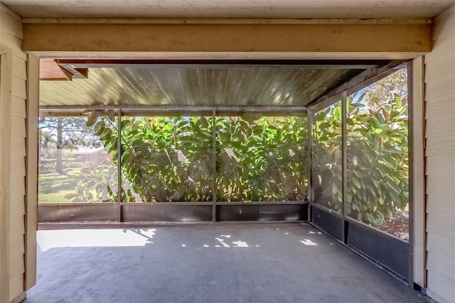 unfurnished sunroom with a wealth of natural light