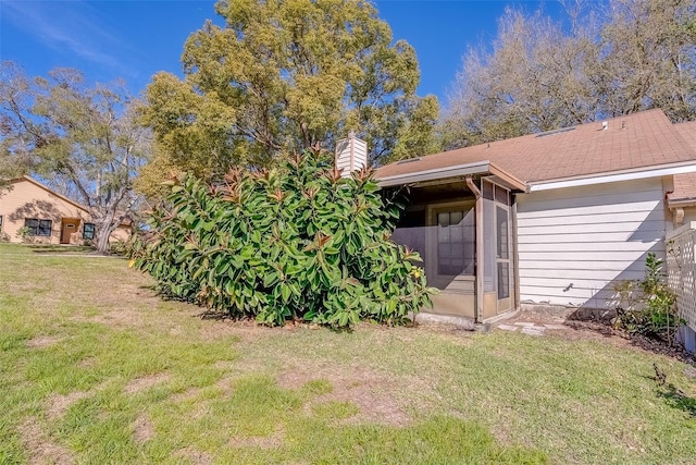 view of yard featuring a sunroom