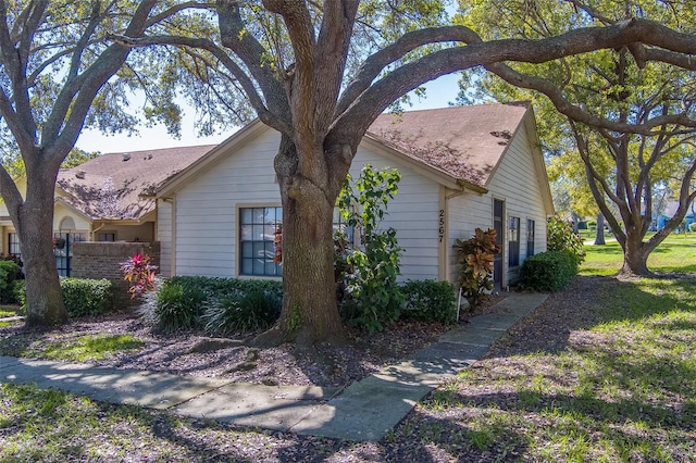 view of home's exterior with fence