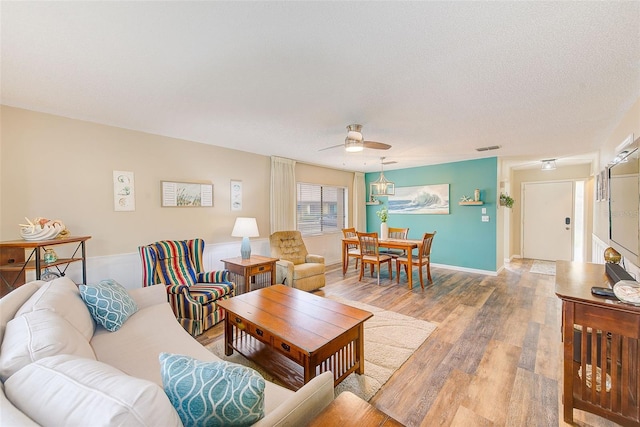2546 Oakleaf Ln Unit 35D, Clearwater, FL 33763 - living room with a ceiling fan, wood finished floors, and a textured ceiling