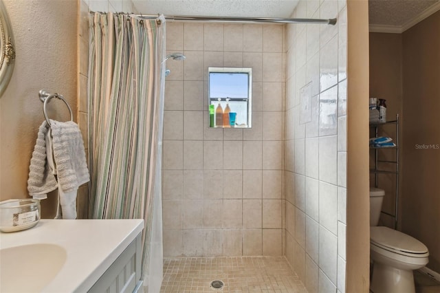 bathroom featuring vanity, ornamental molding, a textured ceiling, toilet, and walk in shower