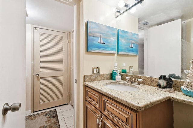 bathroom featuring tile patterned floors and vanity