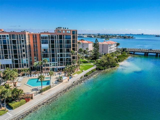 birds eye view of property with a water view