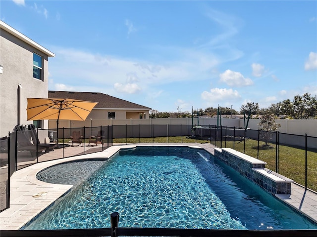 view of pool with a yard and a patio area