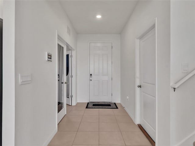 interior space with light tile patterned floors