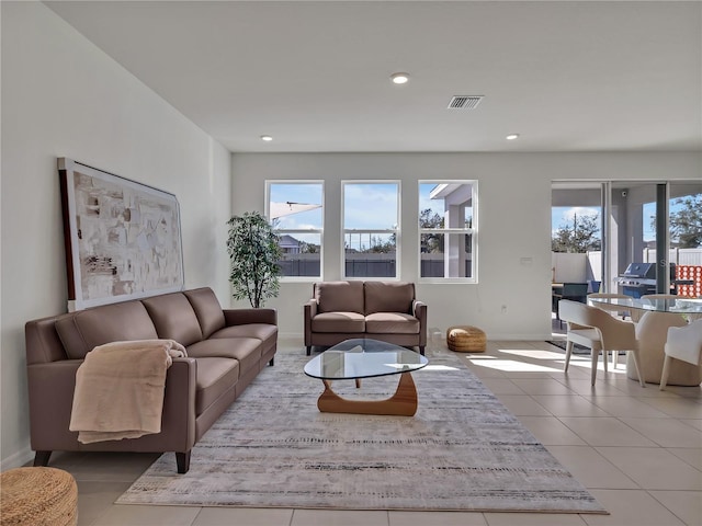 living room featuring light tile patterned floors and plenty of natural light