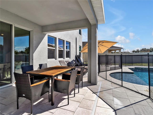 view of patio featuring a fenced in pool