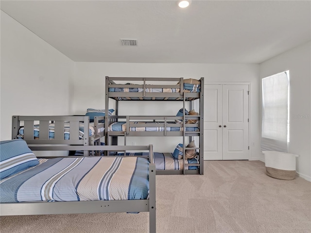 bedroom with a closet and carpet