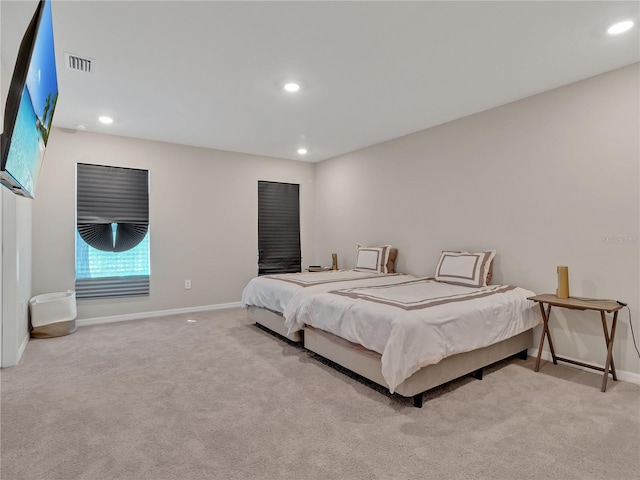 bedroom with light colored carpet