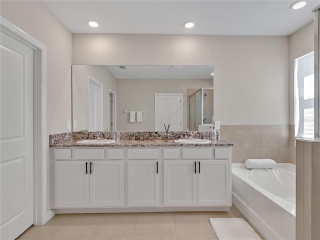 bathroom featuring vanity, tile patterned floors, and independent shower and bath