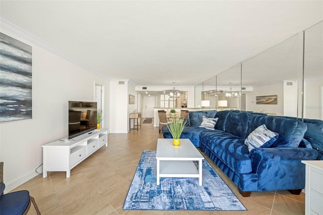 living room featuring ornamental molding, light tile patterned floors, and a notable chandelier