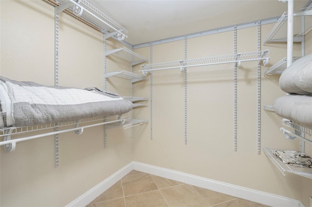 spacious closet featuring tile patterned floors