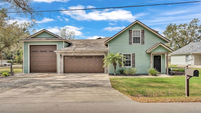 view of front of home featuring a garage and a front lawn