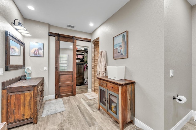 bathroom with wood-type flooring