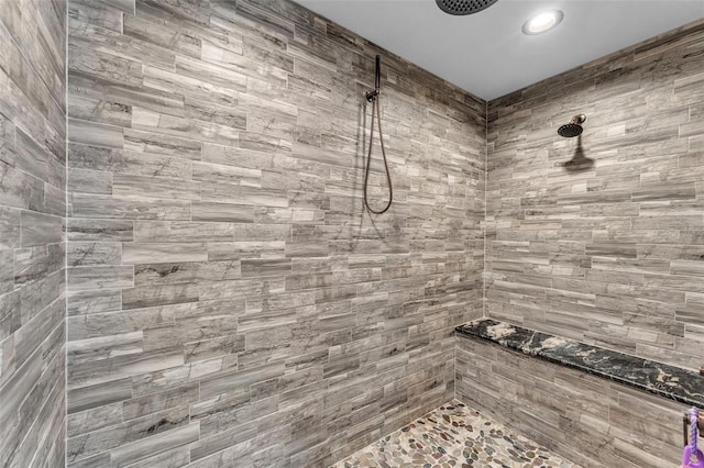 bathroom with a tile shower